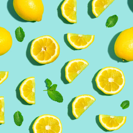 Fresh lemon pattern on a bright color background flat lay